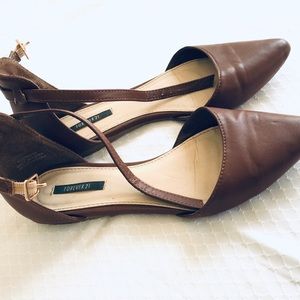 Brown pointed flats